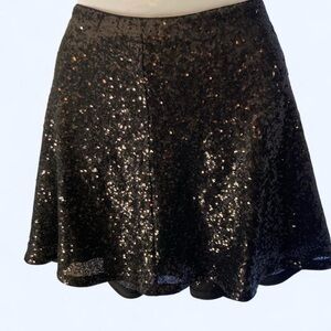 Black sequin mini skirt with flair accents approx L